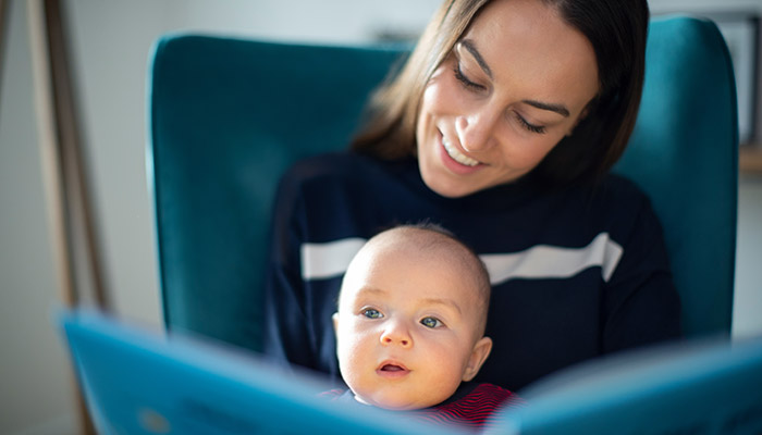 mother reading with baby