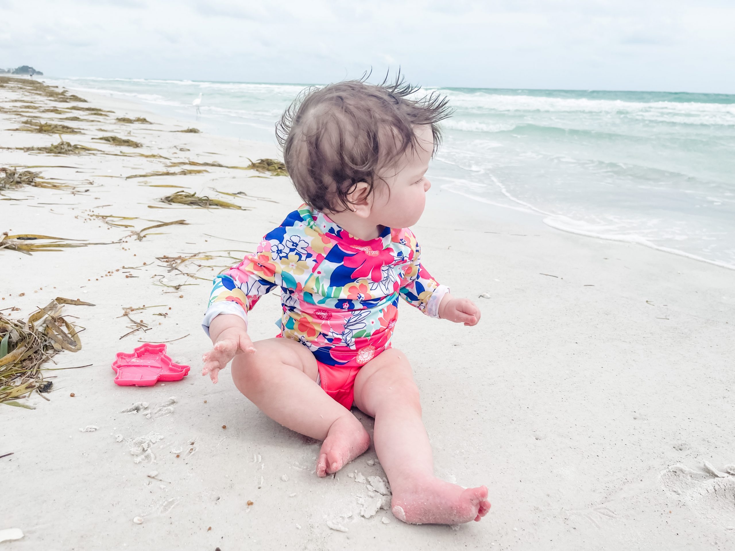 baby girl on beach