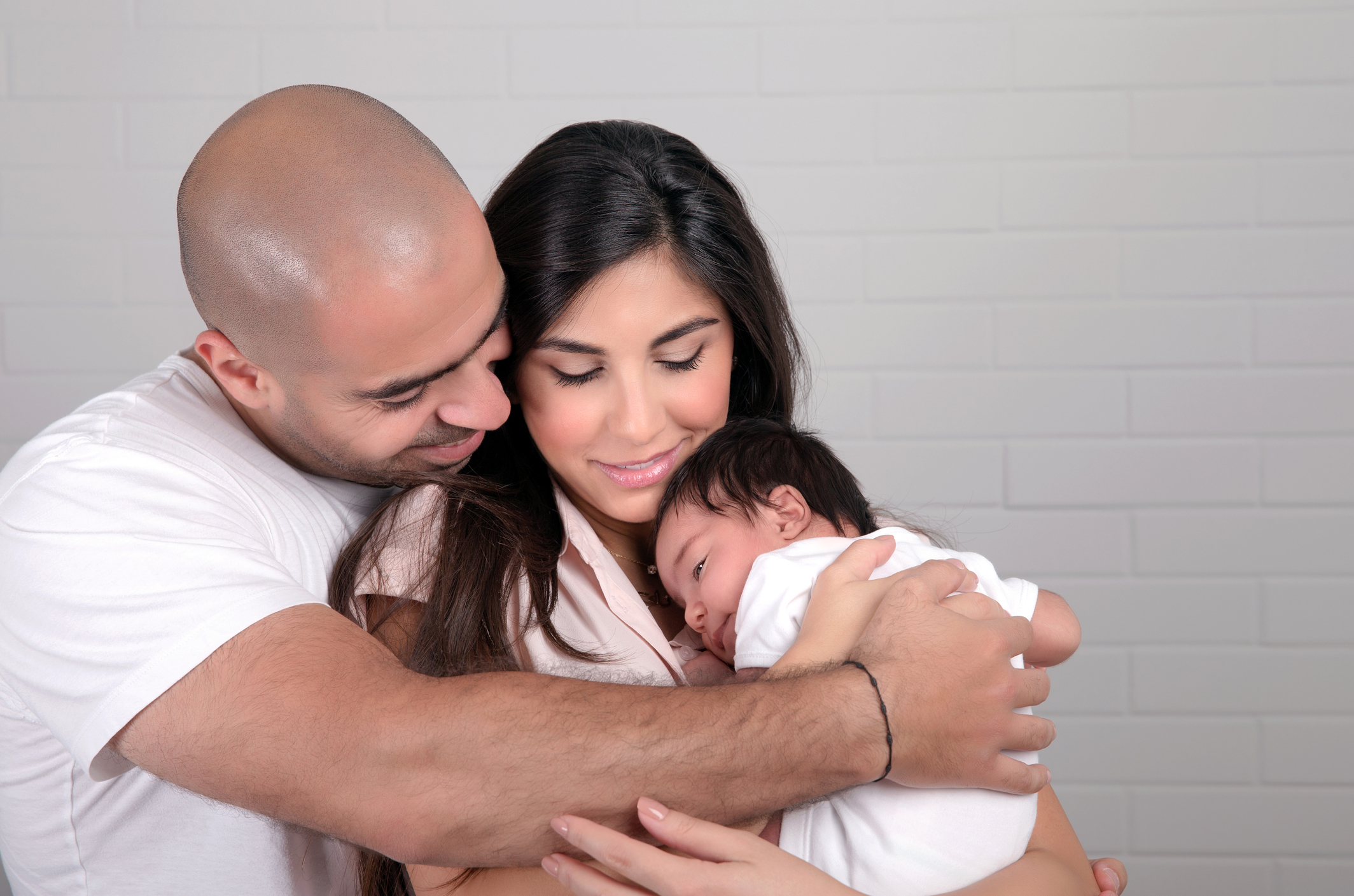 parents holding infant